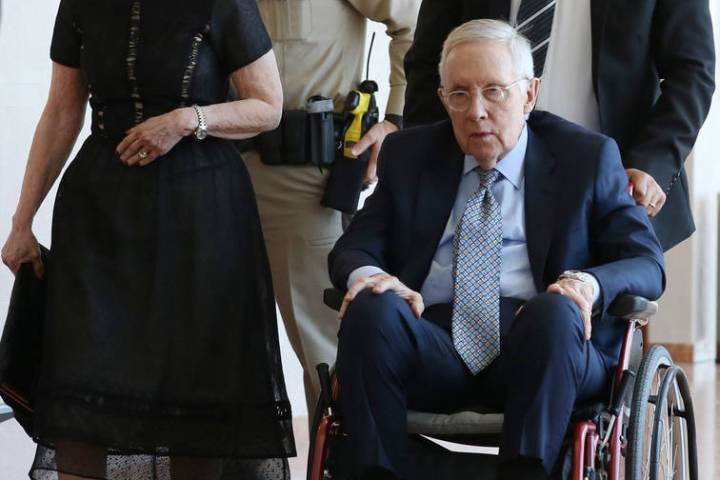 Former U.S. Sen. Harry Reid and his wife, Landra Gould, leave a courtroom at the Regional Justi ...