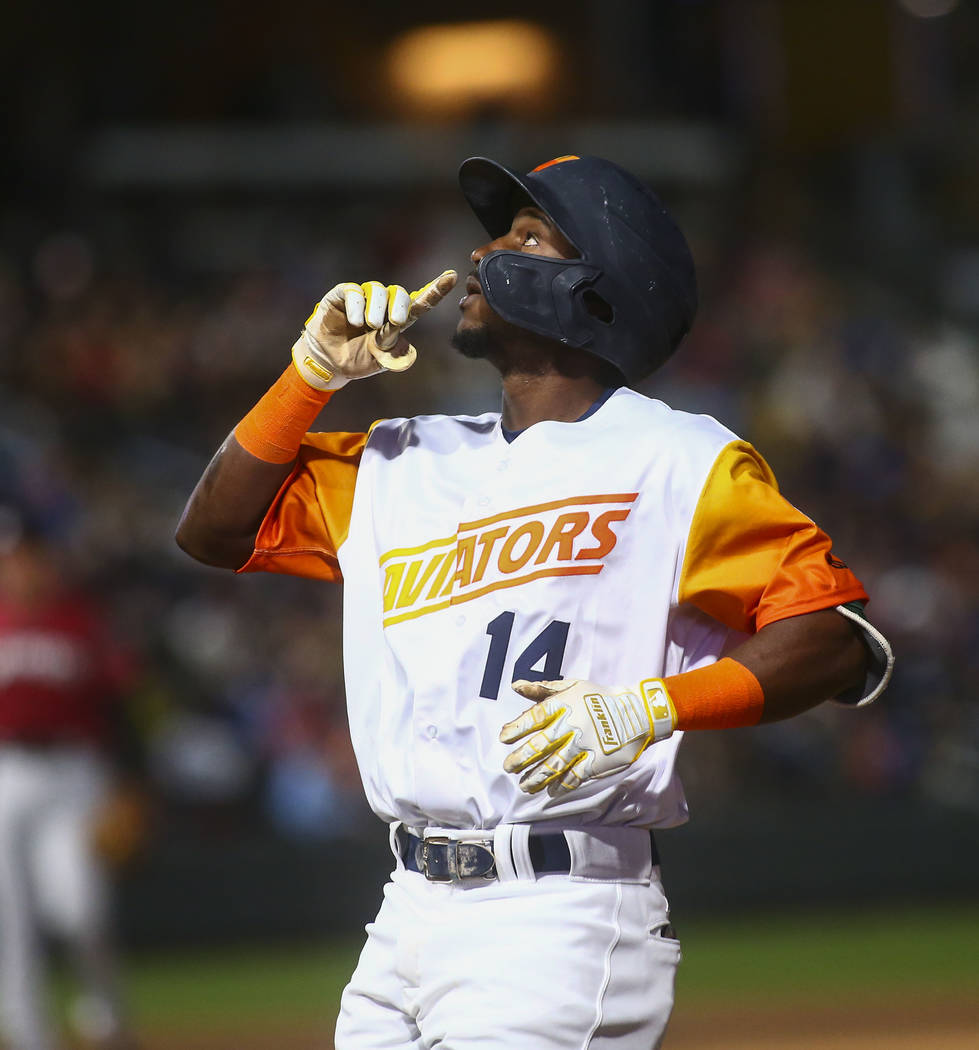Las Vegas Aviators shortstop Jorge Mateo (14) celebrates at first base after a hit during the f ...