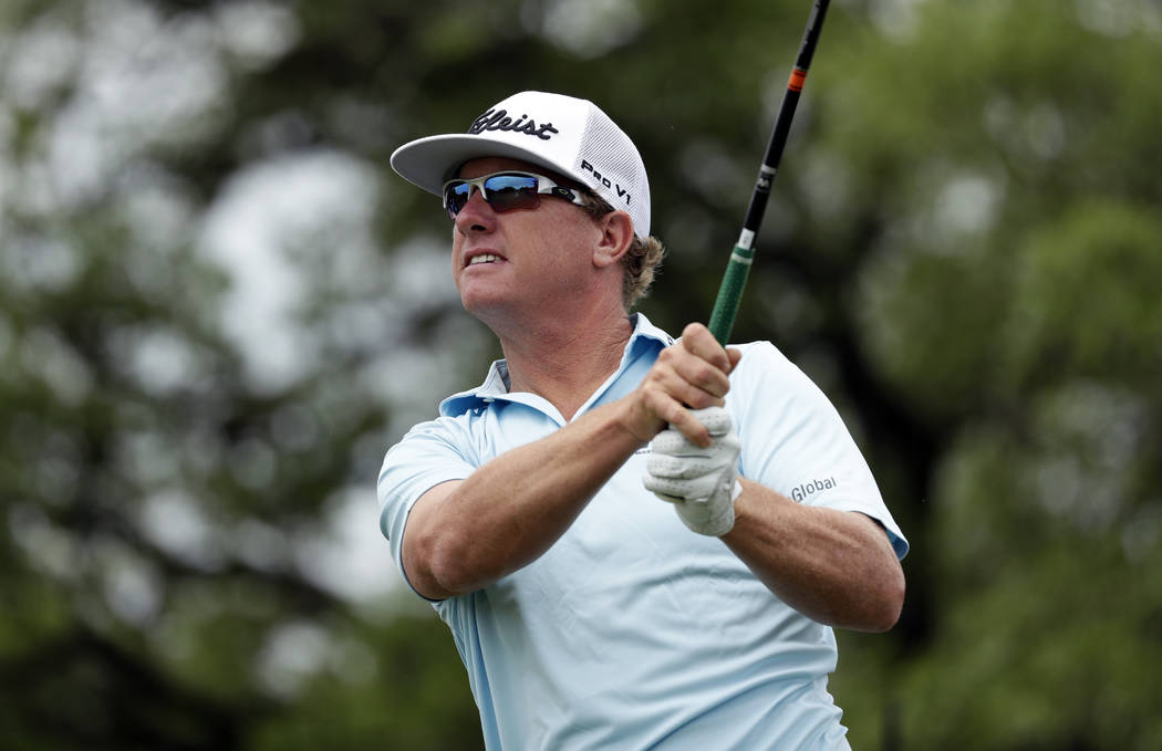 Charley Hoffman watches a shot on the second hole during the final round of the Texas Open golf ...