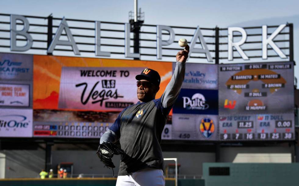 Retired Major League baseball player and now special coach Rickey Henderson works with the Las ...