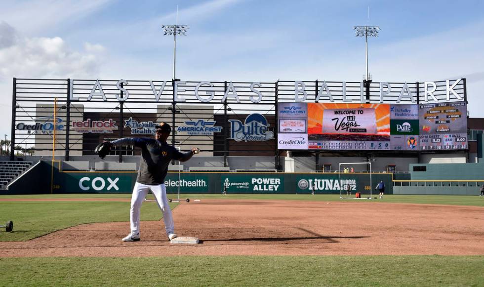 Retired Major League baseball player and now special coach Rickey Henderson works with the Las ...