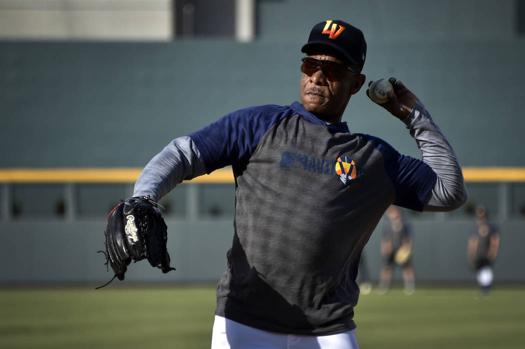 Retired Major League baseball player and now special coach Rickey Henderson works with the Las ...