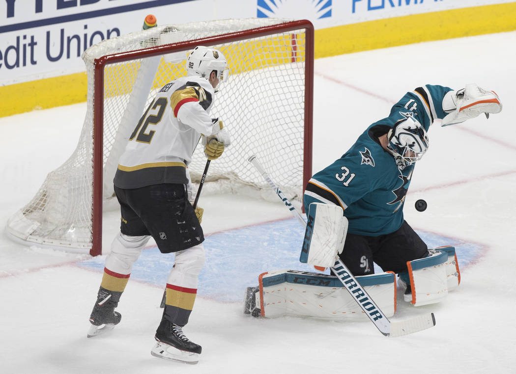 San Jose Sharks goaltender Martin Jones (31) makes a save against Golden Knights left wing Toma ...