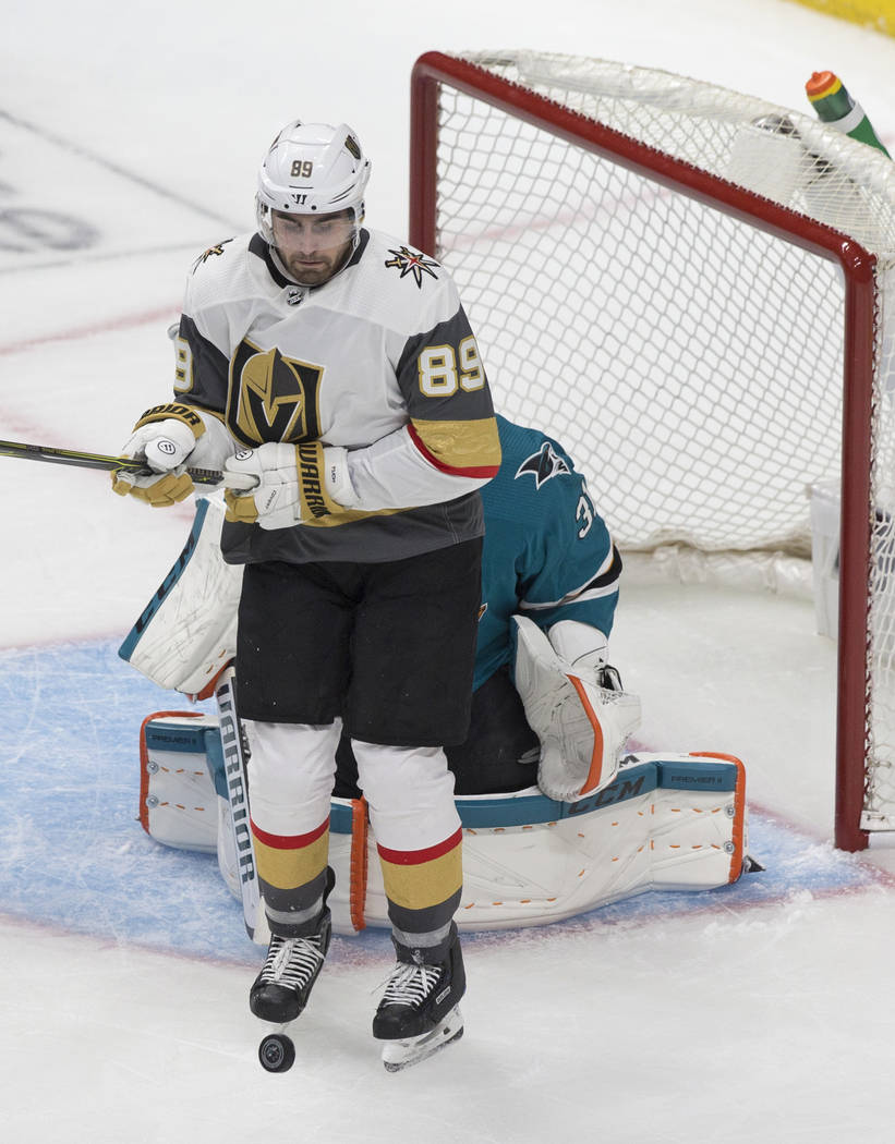 Golden Knights right wing Alex Tuch (89) leaps to get out of the way of the puck in front of Sa ...