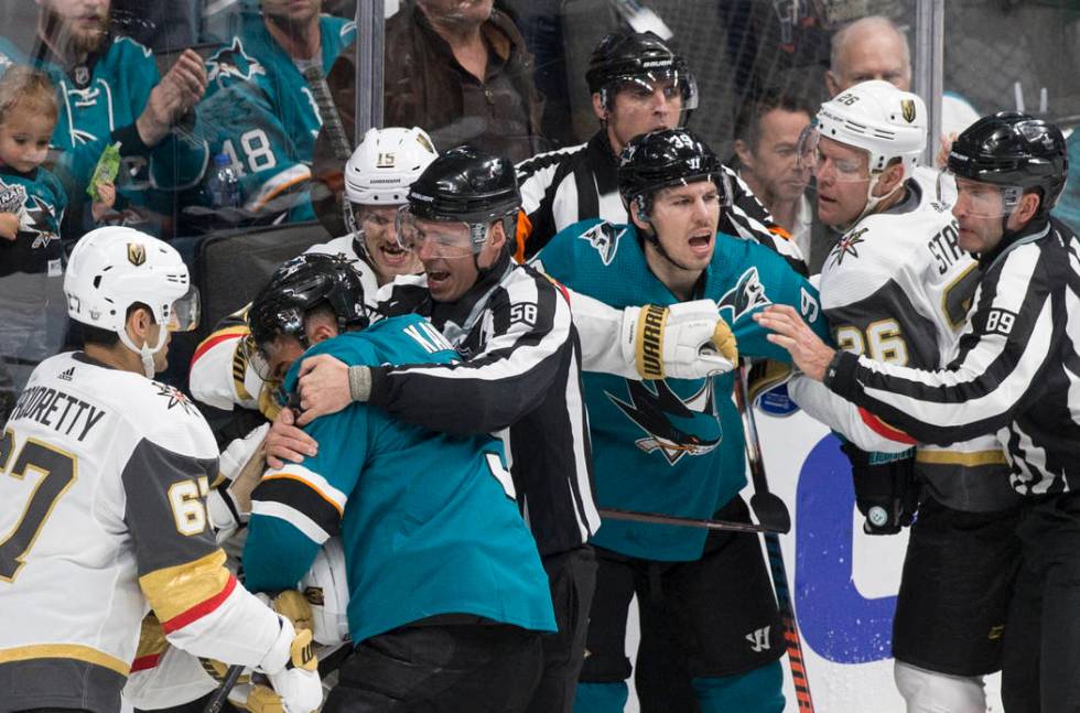 The Golden Knights and San Jose Sharks fight in the first period during game one of the NHL Wes ...