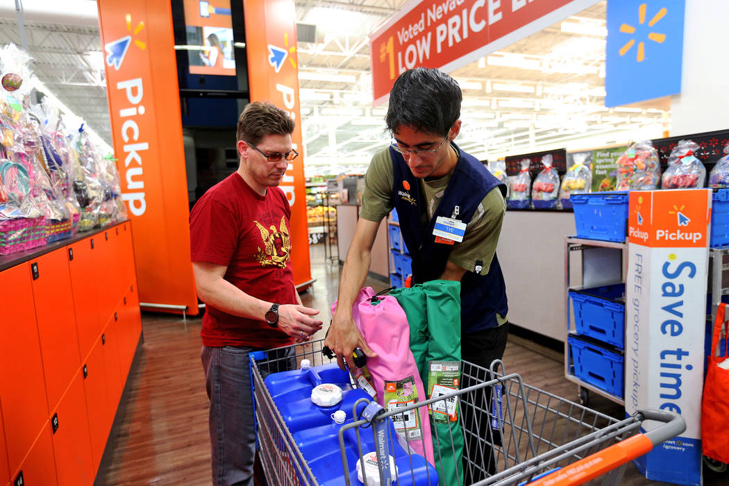 Walmart Associate Molly Tye Bonilla places items in Eric Viggiano's card that he ordered online ...