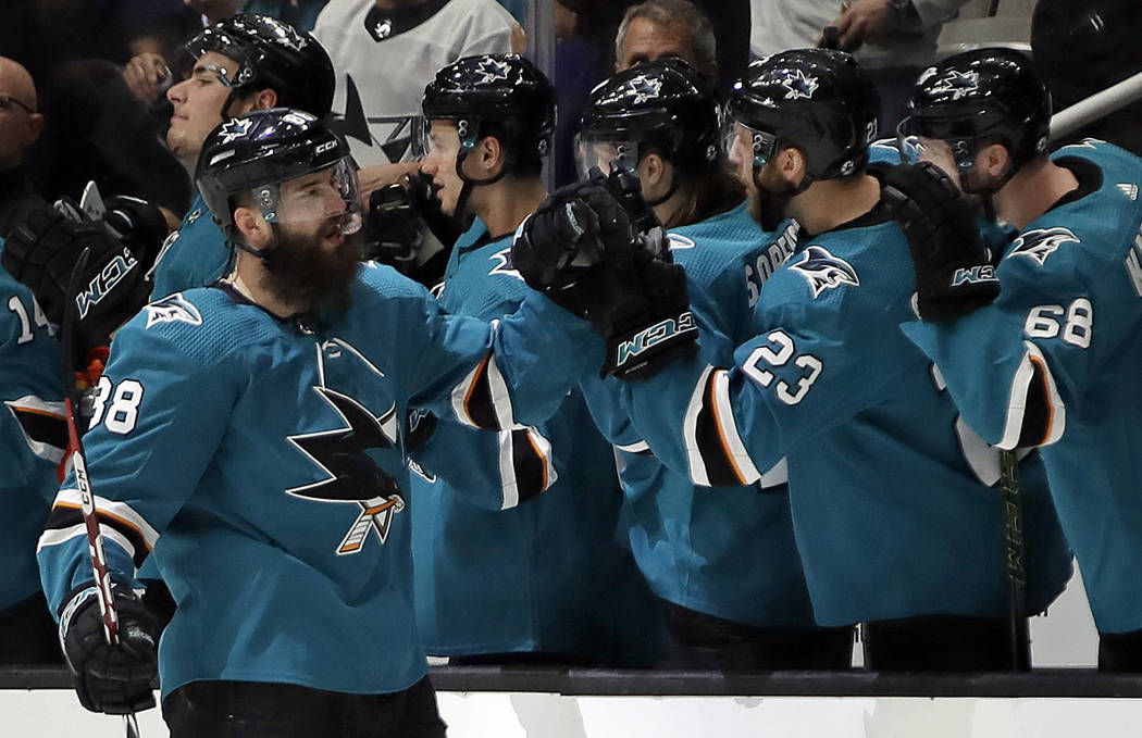 San Jose Sharks' Brent Burns, left, is congratulated for his goal against the Vegas Golden Knig ...