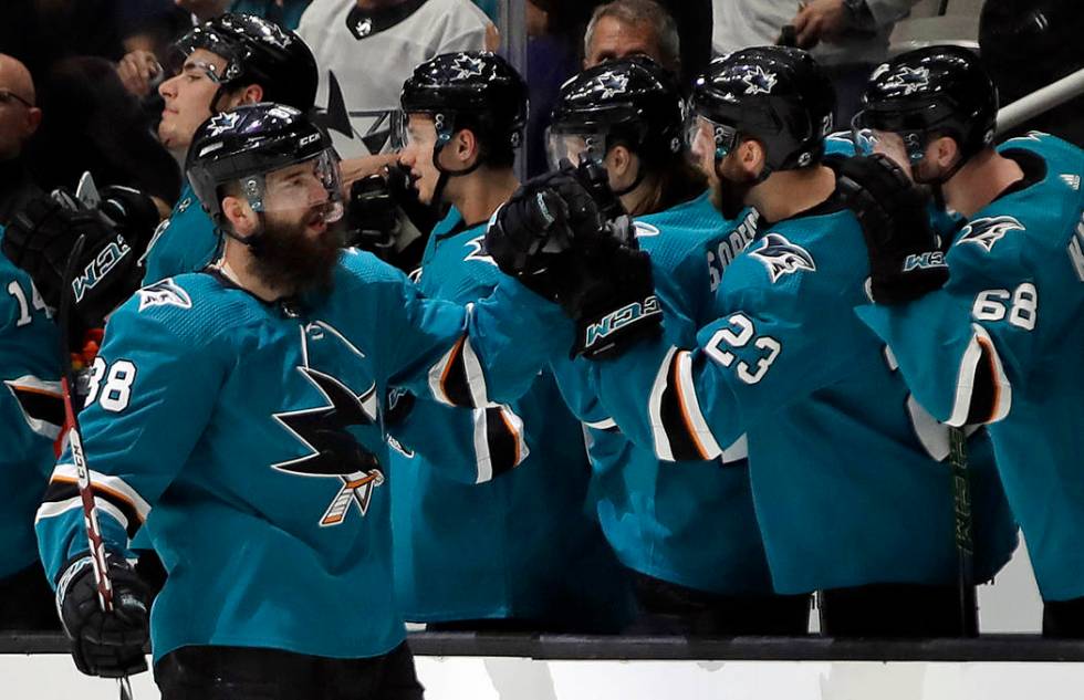 San Jose Sharks' Brent Burns, left, is congratulated for his goal against the Vegas Golden Knig ...