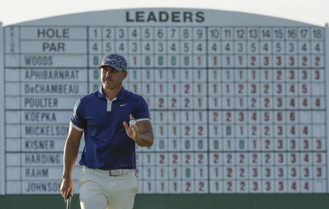 Brooks Koepka walks on the 17th hole during the first round for the Masters golf tournament Thu ...