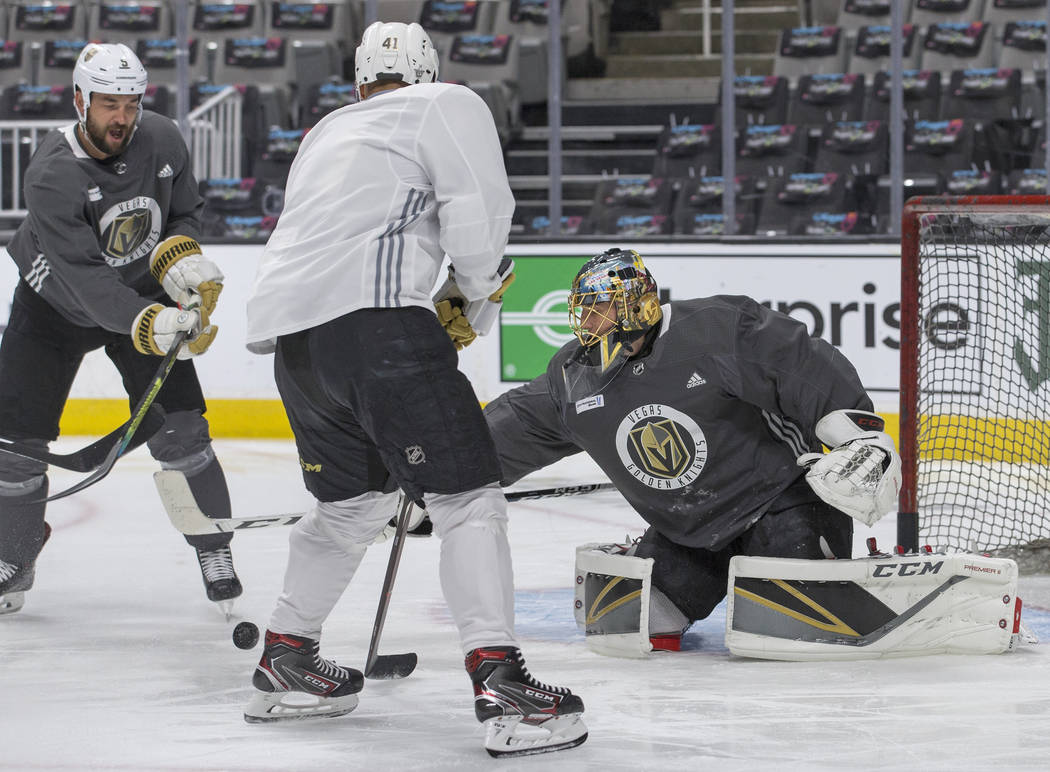 Golden Knights goaltender Marc-Andre Fleury (29) makes a save against Golden Knights defenseman ...