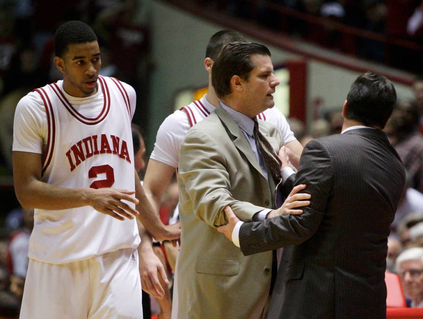 Indiana assistant Tim Buckley hold back head coach Tom Crean, after Crean received his second t ...