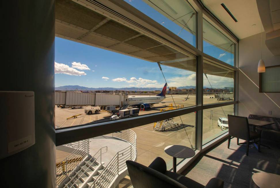 View of the tarmac from the Resting Zone in the new 7,054 square foot The Club at LAS lounge in ...