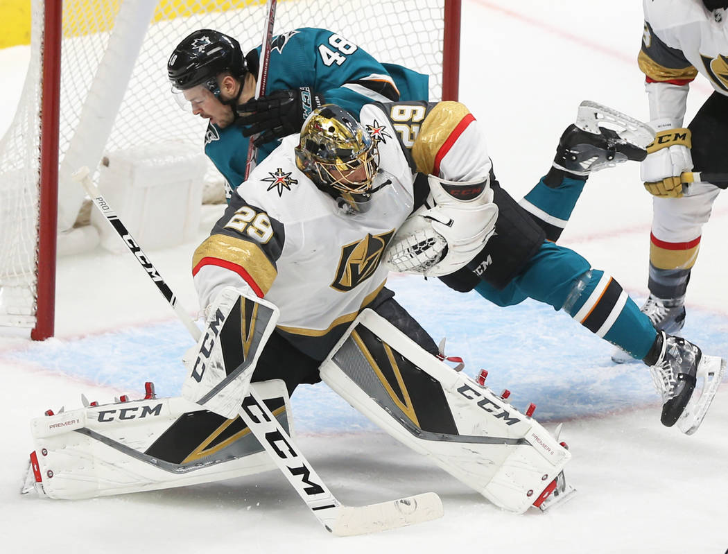 San Jose Sharks center Tomas Hertl (48) collides with Golden Knights goaltender Marc-Andre Fleu ...