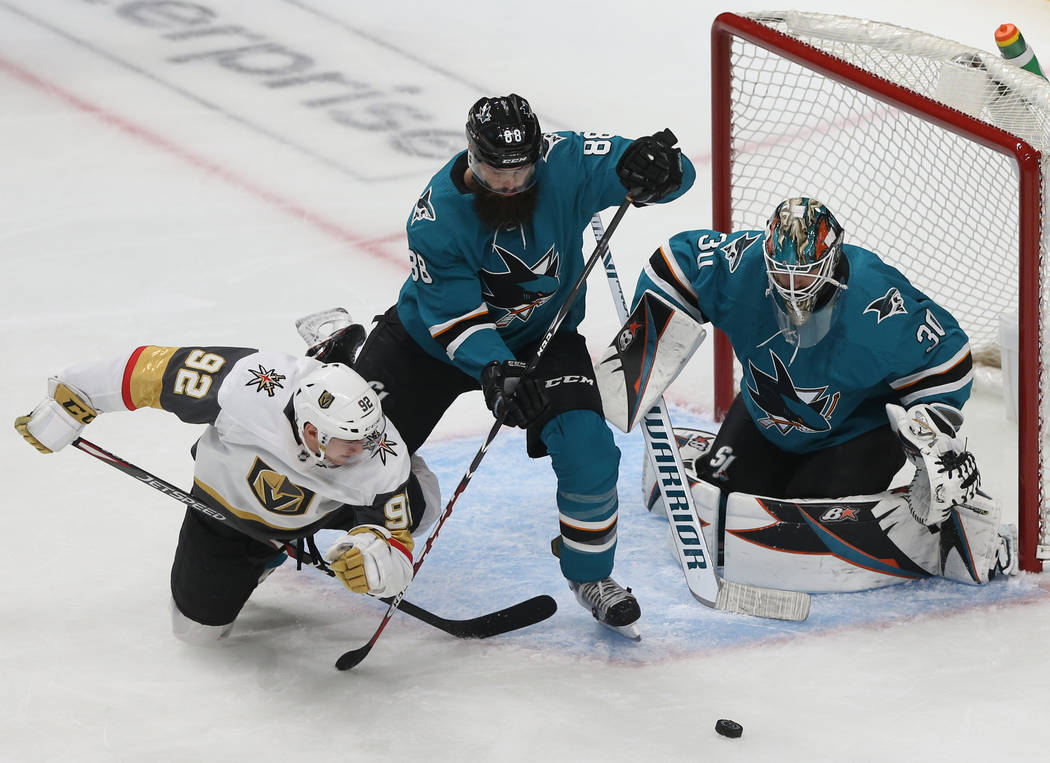 Golden Knights left wing Tomas Nosek (92) shoots on San Jose Sharks goaltender Aaron Dell (30) ...