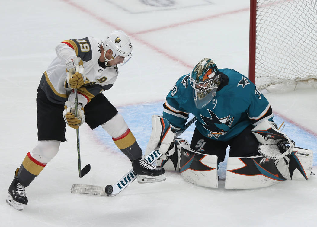 Golden Knights right wing Reilly Smith (19) shoots on San Jose Sharks goaltender Aaron Dell (30 ...