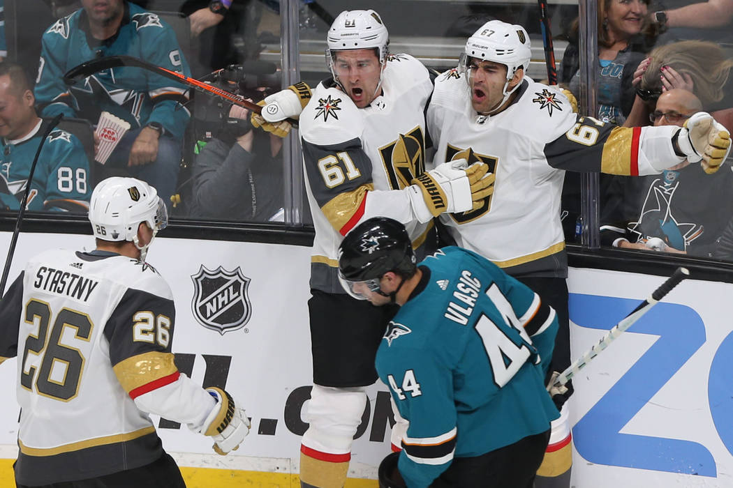 Golden Knights left wing Max Pacioretty (67) celebrates with teammates Mark Stone (61) and Paul ...