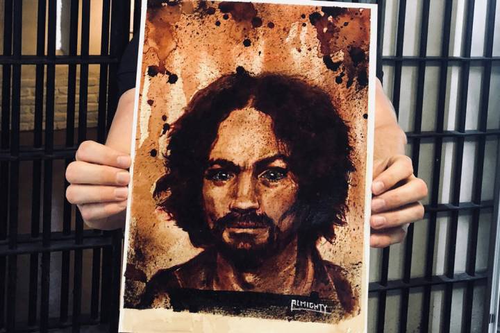 Zak Bagans of "Ghost Adventurers" on Travel Channel shows a painting of Charles Manson, with Ma ...