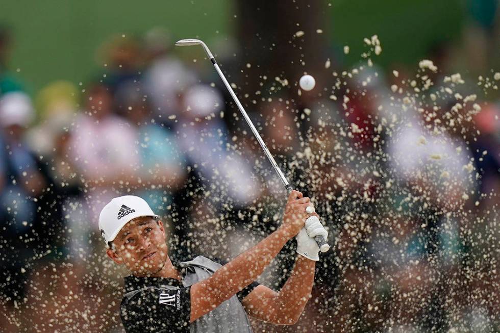 Xander Schauffele hits from a bunker on the seventh hole during the final round for the Masters ...