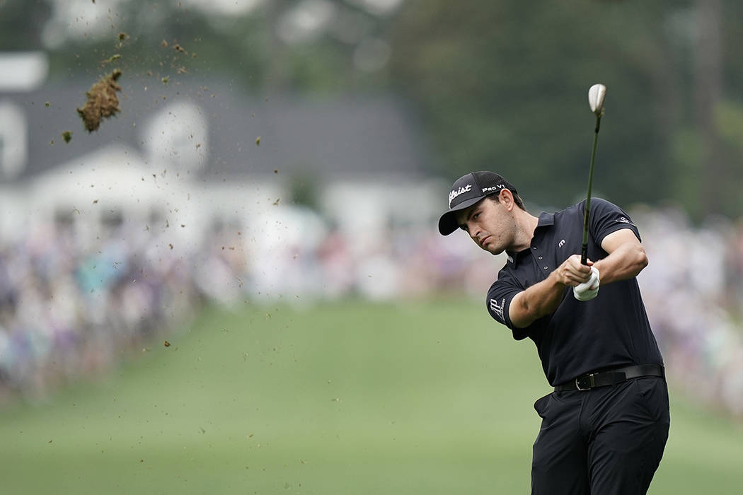 Patrick Cantlay hits on the first hole during the final round for the Masters golf tournament, ...