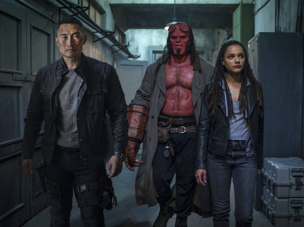 This image released by Lionsgate shows, from left, Daniel Dae Kim, David Harbour and Sasha Lane ...