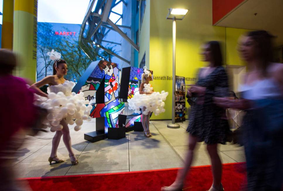 Michelle Bell, left, and Lucie May model dresses by balloon artist Ronnie Johnson during Bubble ...