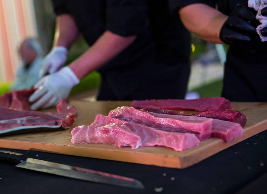 Bluefin tuna is prepare by chefs from Naked Fish during UNLVino's Sake Fever event at Red Rock ...