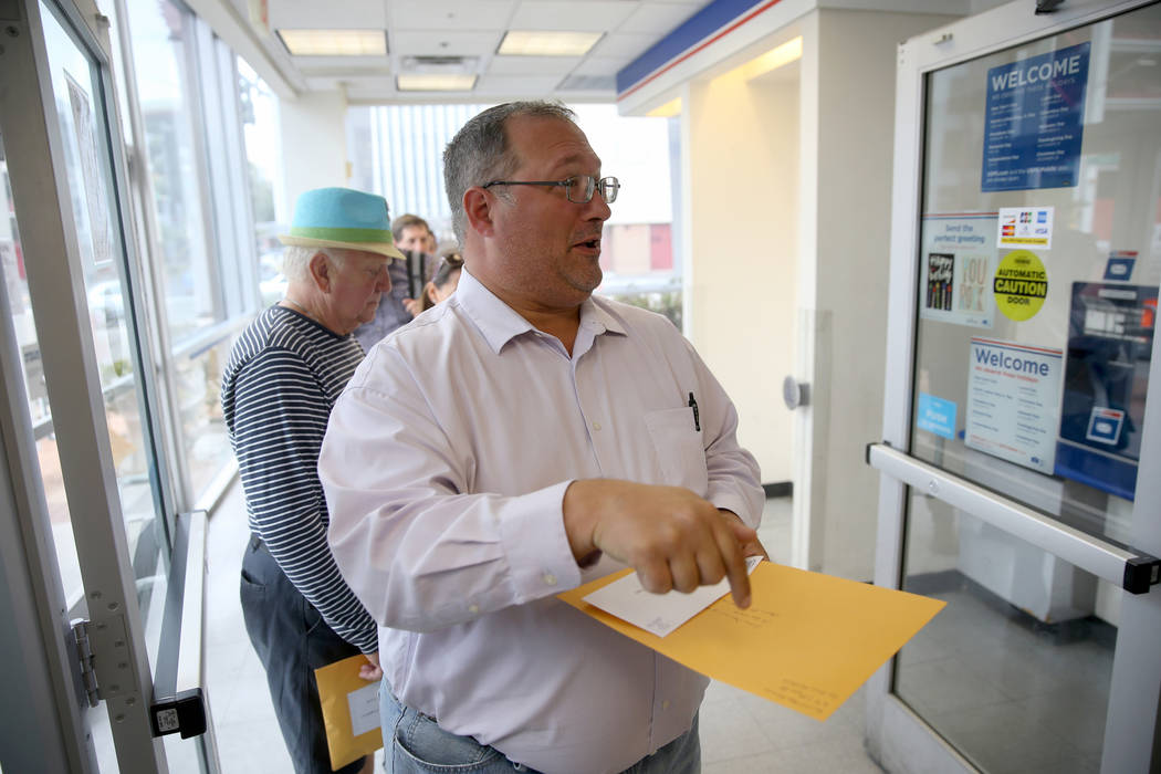 Jeffrey Balcom, 44, of Las Vegas, waits to mail his taxes at the Downtown Las Vegas Post Office ...