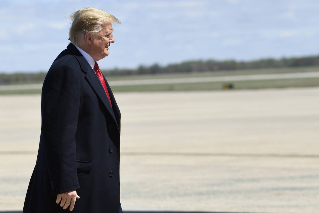 President Donald Trump walks towards the steps of Air Force One at Andrews Air Force Base in Md ...