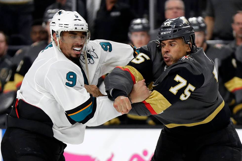 Vegas Golden Knights right wing Ryan Reaves (75) and San Jose Sharks left wing Evander Kane (9) ...