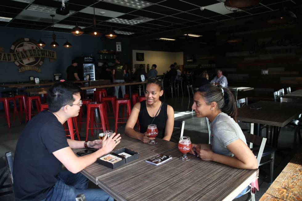 Steven Young, from left, Alaina Geary, and Jessica Pharar, at Bad Beat Brewing in Henderson, Sa ...