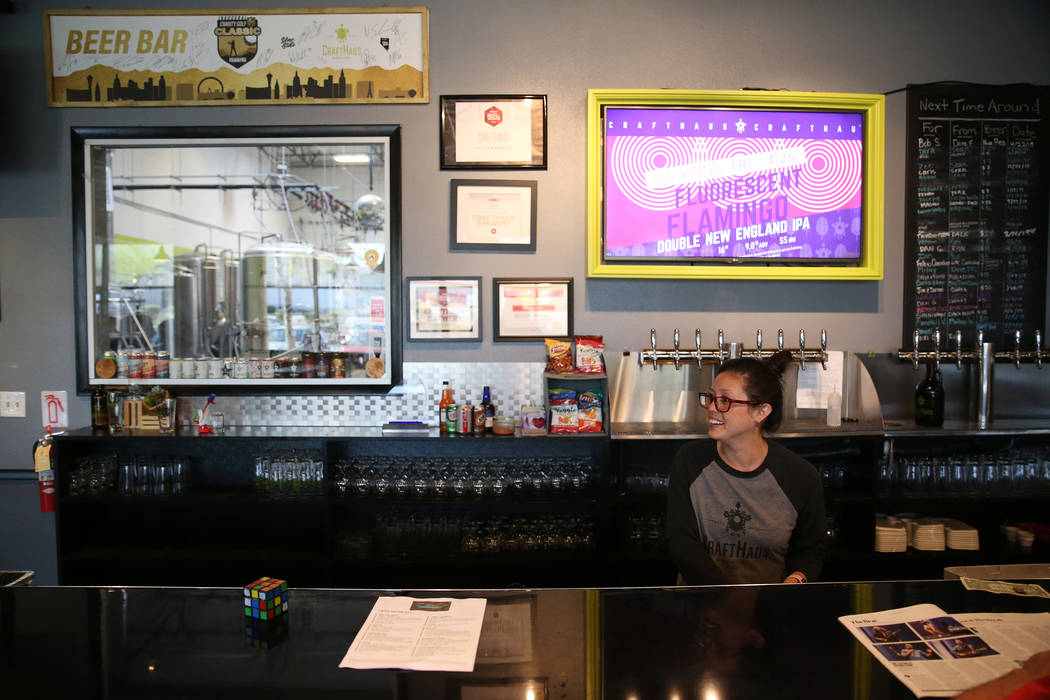 Beertender cleans glasses at CraftHaus Brewery in Henderson, Saturday, April 13, 2019. (Erik Ve ...