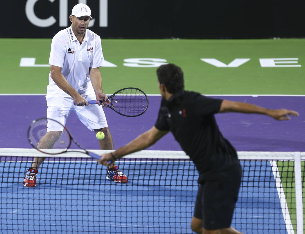 Andy Roddick, left, and Mark Philippoussis compete during a World Team Tennis charity exhibitio ...