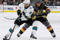 San Jose Sharks left wing Evander Kane (9) tries to skate around Vegas Golden Knights right win ...