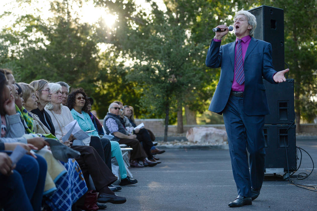 Pastor Bill Walker sings during a sunrise Easter service at the Palm Mortuaries and Cemeteries ...