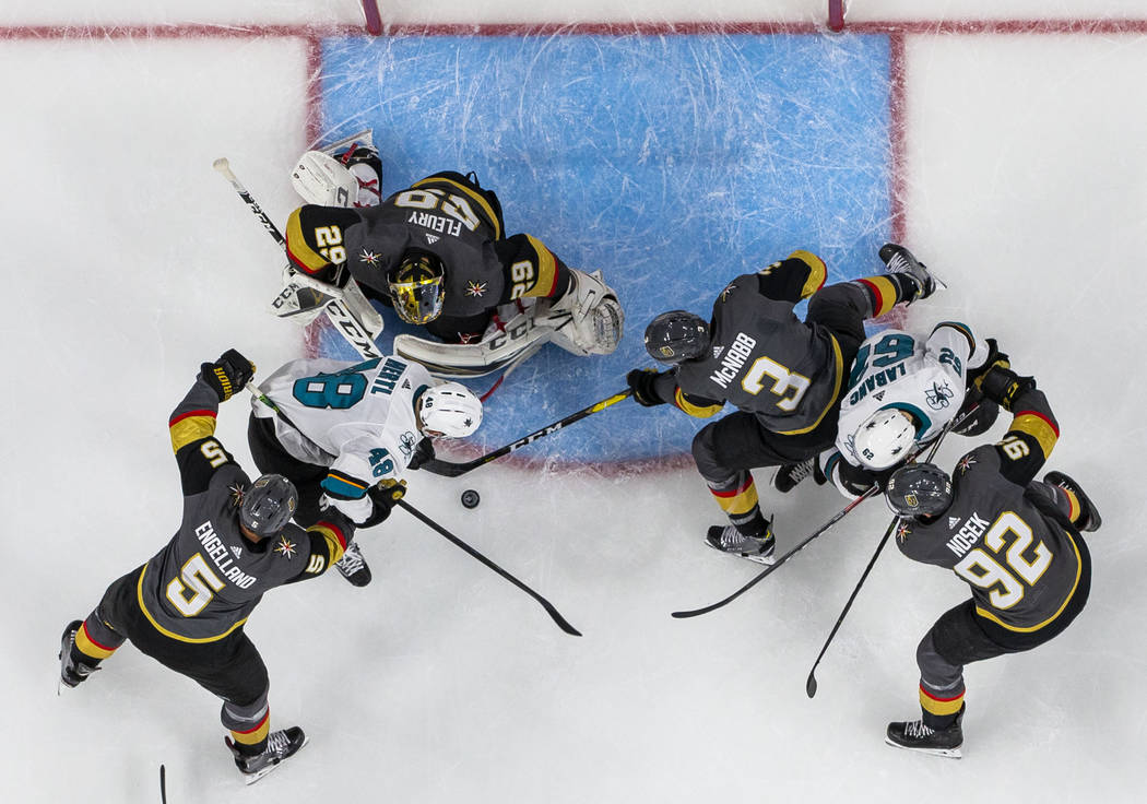 Golden Knights goaltender Marc-Andre Fleury (29) defends the net from San Jose Sharks center To ...