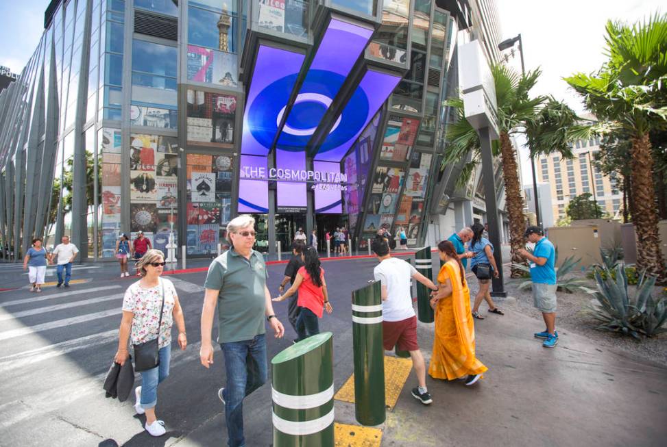 People walk outside The Cosmopolitan of Las Vegas on The Strip on Thursday, May 31, 2018. Richa ...