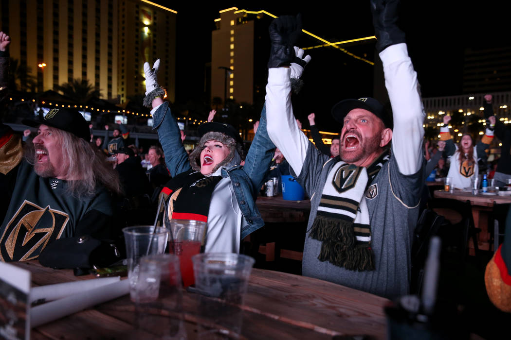 Vegas Golden Knights fans, from left, Rich Michalik, of Las Vegas, Jayne Post and her husband ...