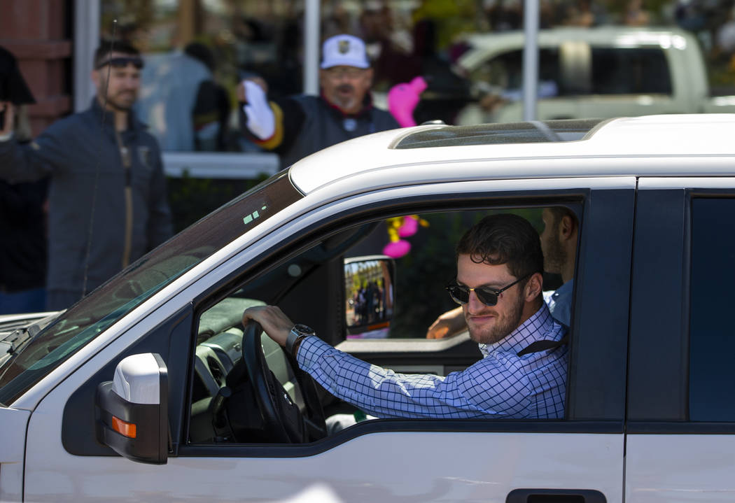 Golden Knights defenseman Colin Miller smiles at fans while departing City National Arena for S ...