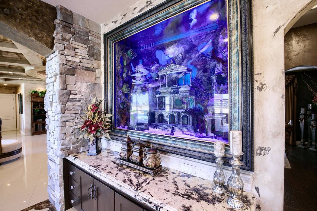 An aquarium sits in the kitchen of Brett Raymer's northwest Las Vegas home. (Signature Real Est ...