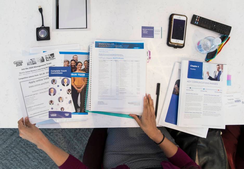 U.S. Department of Commerce partnership specialist Arlene Alvarez looks through her 2020 census ...