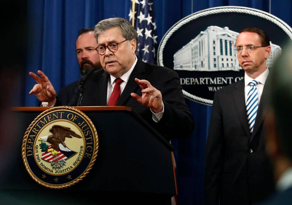 Attorney General William Barr speaks alongside Deputy Attorney General Rod Rosenstein, right, a ...