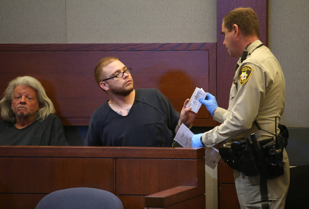 Jon Kennison, 27, is told to put a note that he had been displaying away during an appearance i ...