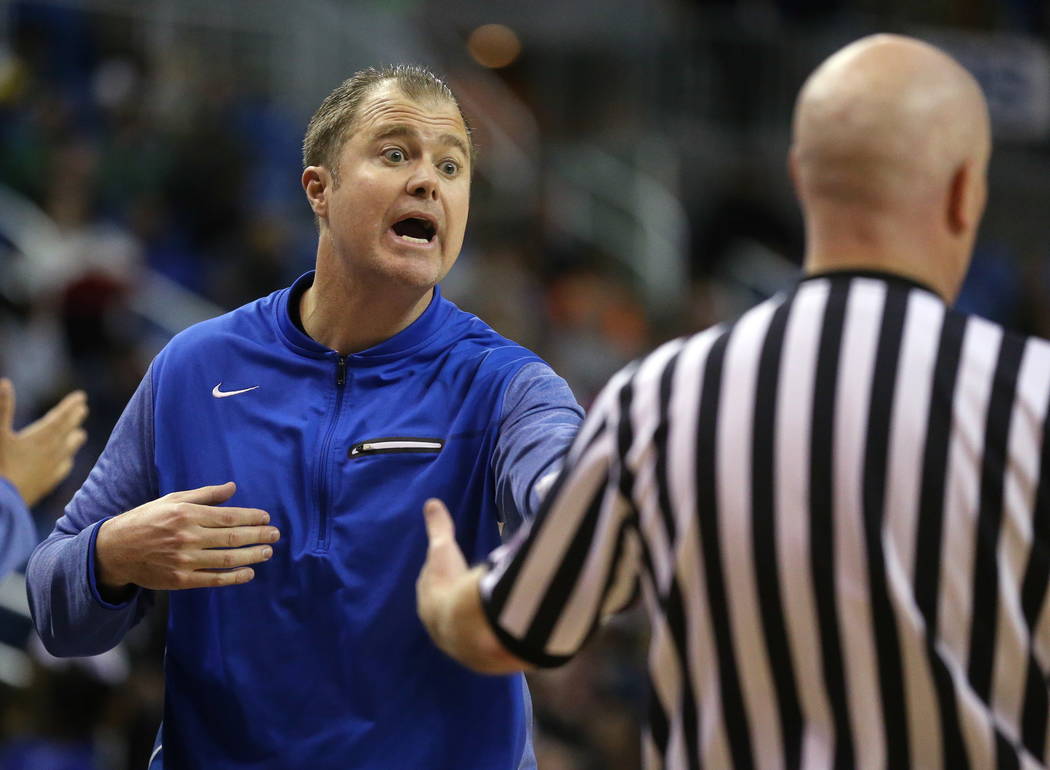 Bishop Gorman head coach Grant Rice works the 4A NIAA state basketball championship game agains ...