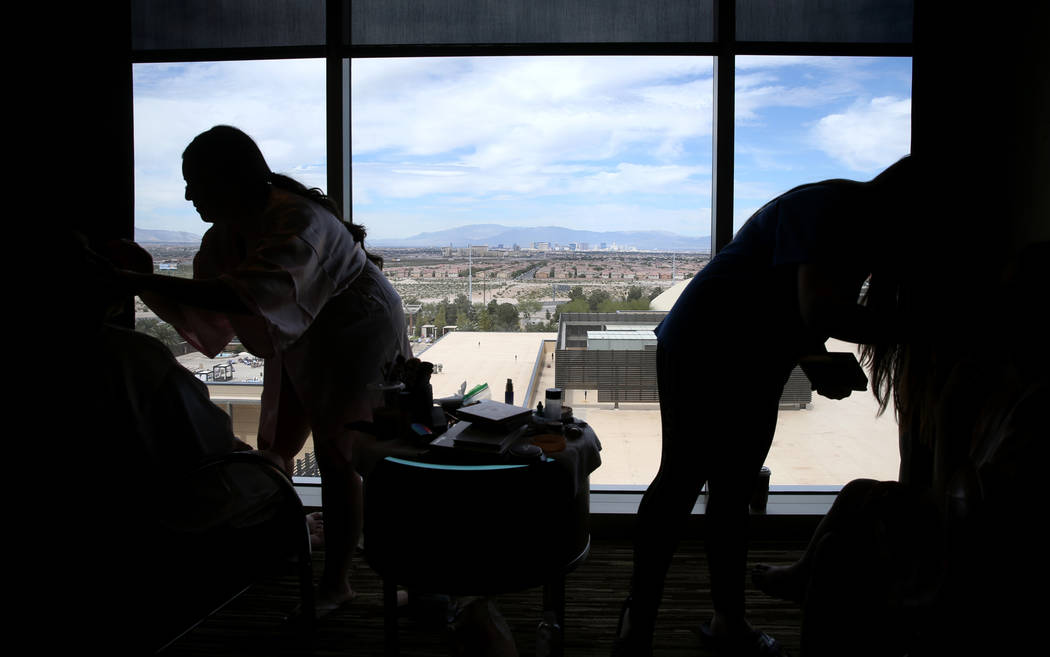 Bride Kimberly King gets her makeup done by her sister Cassie Castaneda in her room at the M Re ...