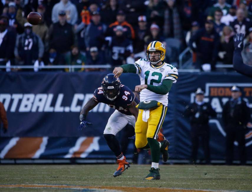 Green Bay Packers quarterback Aaron Rodgers (12) looks to pass against the Chicago Bears during ...