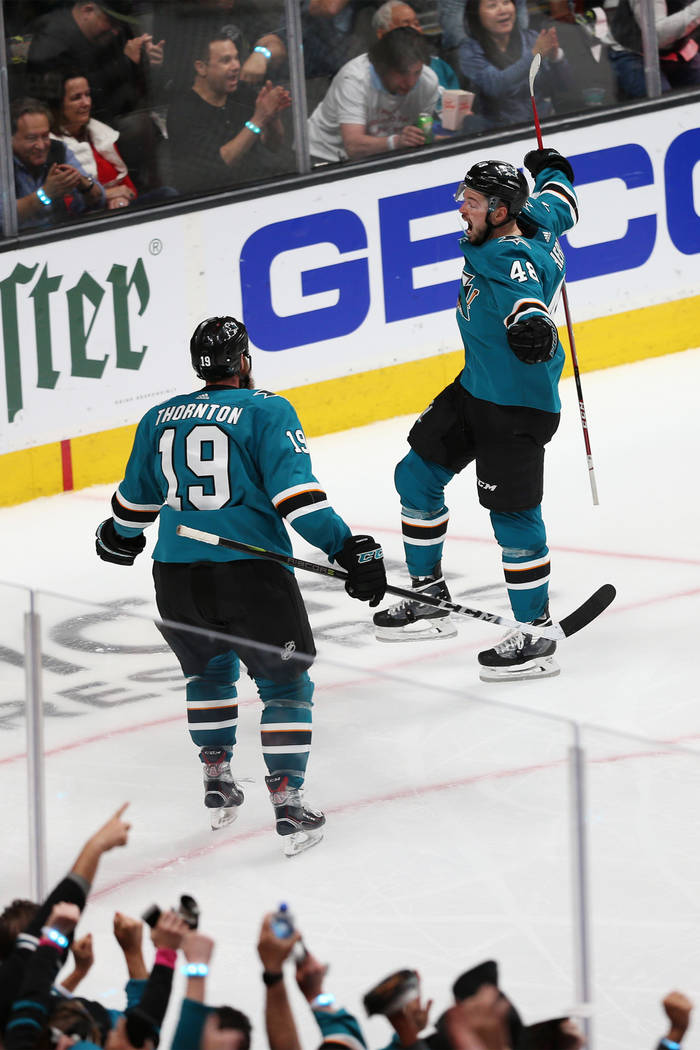 San Jose Sharks center Tomas Hertl (48) celebrates a score as center Joe Thornton (19) looks on ...