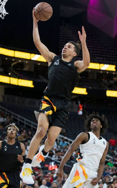 Cole Anthony (50) slices to the rim past Tyrese Maxey (3) in the first half during the Jordan B ...