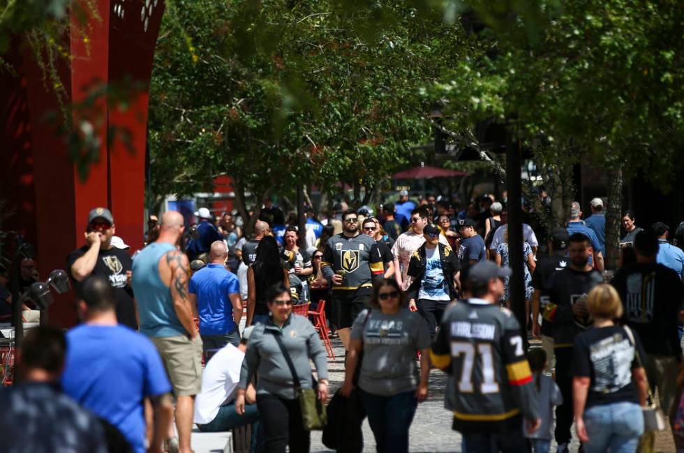 Golden Knights fans walk through the Park before the start of Game 6 of an NHL Western Conferen ...