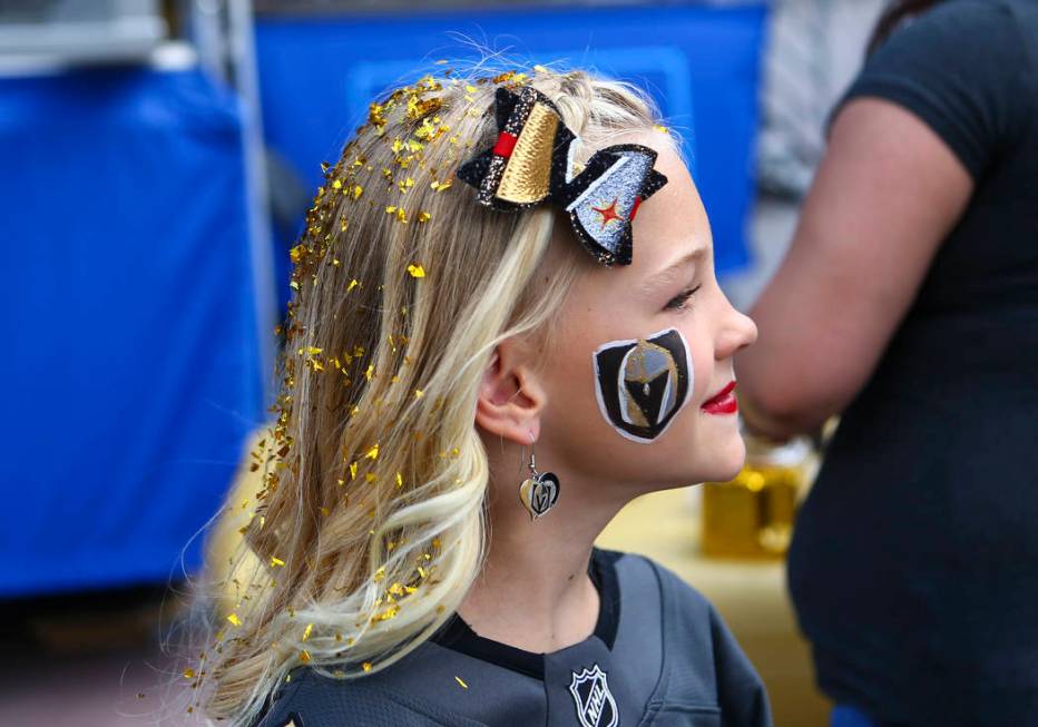 Savannah Lunkwitz, 8, of Las Vegas, shows off her face paint before the start of Game 6 of an N ...
