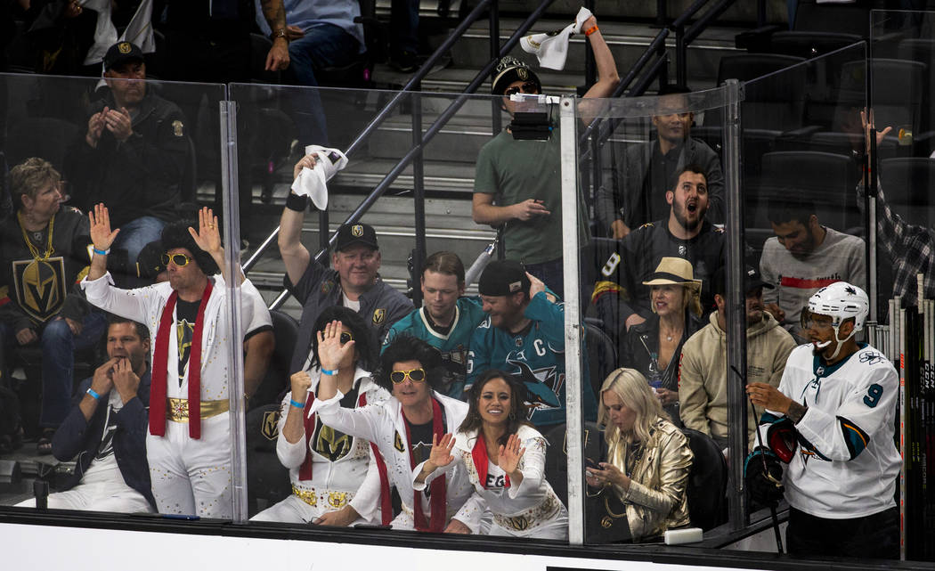 The Elvis themed Golden Knights fans help celebrate a goal by Golden Knights center Jonathan Ma ...